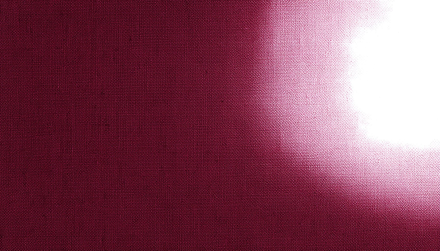 Dark burgundy textile background with subtle woven texture, deep crimson and maroon tones