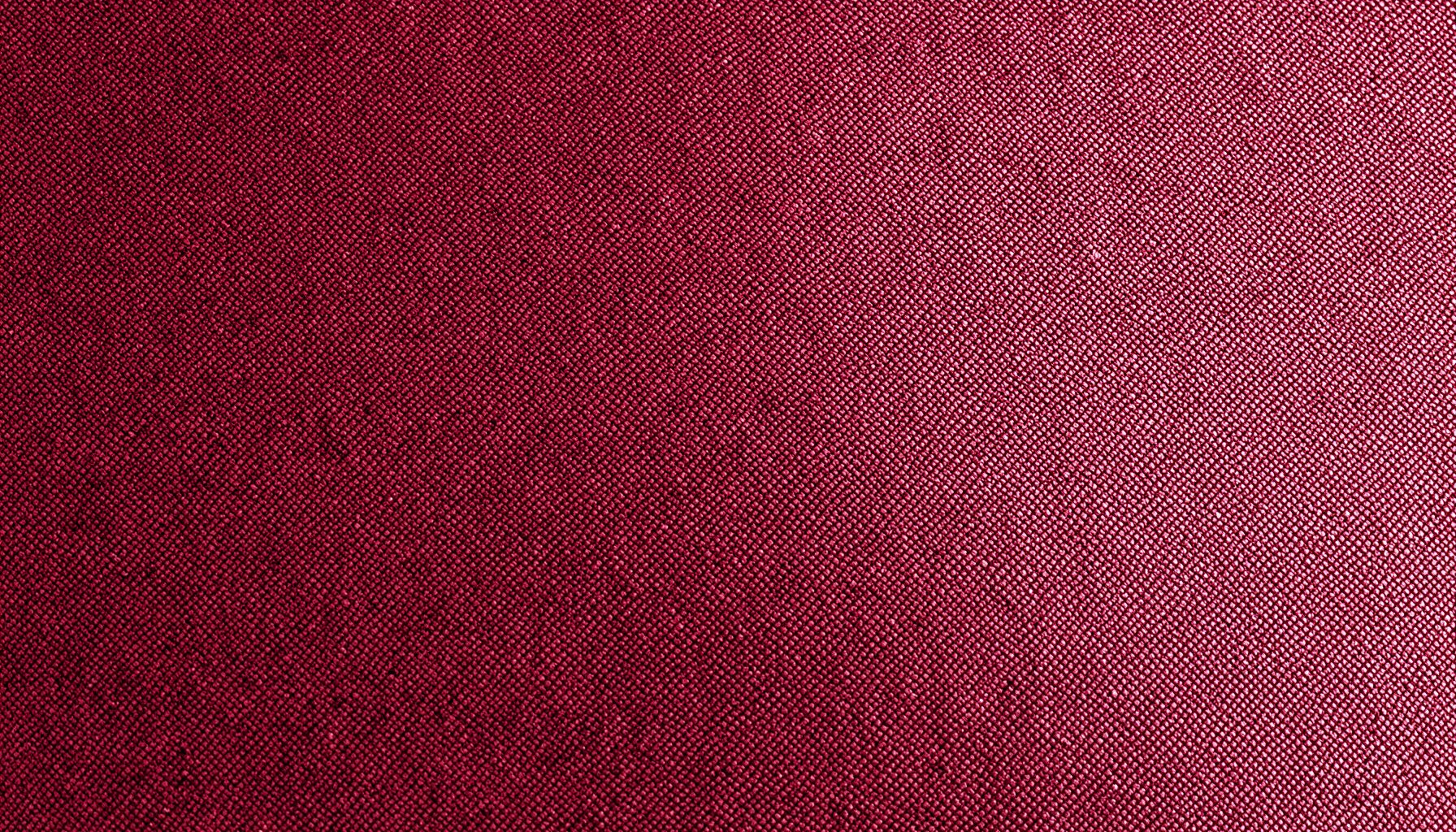 Dark crimson fabric texture with subtle woven patterns, deep burgundy and maroon tones